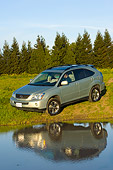 AUT 15 RK0985 01
2006 Lexus RX400 Hybrid Light Green 3/4 Front View By Water And Trees