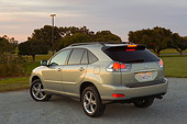 AUT 15 RK0988 01
2006 Lexus RX400 Hybrid Light Green 3/4 Rear View On Pavement By Trees At Dusk