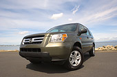 AUT 15 RK1033 01
2006 Honda Pilot LX Green Low 3/4 Front View On Pavement By Water