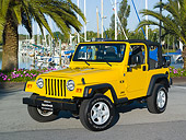 AUT 15 RK1045 01
2006 Jeep Wrangler Yellow Front 3/4 View On Pavement By Harbor