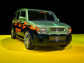 AUT 15 RK1073 01
2007 Honda Element Custom Green 3/4 Front View On Yellow Floor