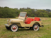 AUT 15 RK1118 01
1962 Willys Jeep DJ 3A Tan 3/4 Side View On Grass