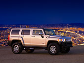 AUT 15 RK1160 01
2007 Hummer H3 Silver 3/4 Front View On Pavement At Dusk City
