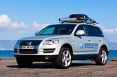 AUT 15 RK1168 01
2008 Volkswagen Touareg TDI Silver 3/4 Front View On Pavement By Water Sky