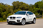 AUT 15 RK1196 01
2008 BMW X6 xDrive35i Crossover SUV White 3/4 Front View By Trees