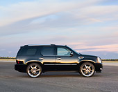 AUT 15 RK1204 01
2007 Cadillac Escalade  Black Profile View Cloudy Sky