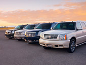 AUT 15 RK1210 01
2007, 2004, 2007 & 2004 (L-R) Cadillac Escalades 3/4 Front View At Dusk