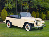 AUT 15 RK1216 01
1950 Willys Jeepster Yellow 3/4 Front View On Grass By Trees
