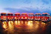AUT 16 RK0086 16
Wide Angle Shot Of Fire Trucks Lined In A Row On Wet Pavement