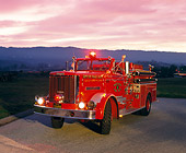 AUT 16 RK0097 03
1961 Oshkosh 120 GPM Pumper Front 3/4 View On Pavement At Dusk