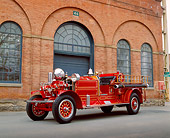 AUT 16 RK0127 01
1923 Arhens Fox Fire Engine Red 3/4 Front View On Pavement By Brick Building