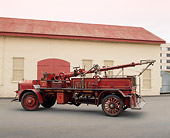 AUT 16 RK0139 02
1927 American La France Deluge Truck Red 3/4 Rear View On Pavement By Building