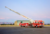 AUT 16 RK0179 01
2009 Pierce Quantum 100 Foot Tiller Truck 3/4 Front View On Pavement By Hangar