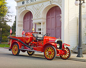AUT 16 RK0187 01
1923 American LaFrance Brockway Torpedo Fire Truck Red 3/4 Front View On Pavement By Building