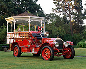 AUT 16 RK0193 01
1922 American LaFrance Pumper Fire Truck Red 3/4 Front View On Grass By Gazebo