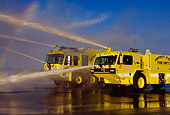 AUT 16 RK0028 16
1997 Oshkosh T-1000 #8 And 1998 Teledyne P-23 #9 Crash Truck Yellow 3/4 Front View Spraying Water