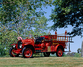 AUT 16 RK0043 03
1924 American LaFrance Chemical Hose Wagon 3/4 Front View On Grass By Trees