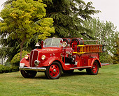 AUT 16 RK0050 04
1937 Ford Van Pelt Firetruck Red 3/4 Front View On Grass By Trees
