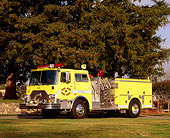 AUT 16 RK0094 04
1991 Mack 1500 GPM Yellow 3/4 Front View On Grass By Trees