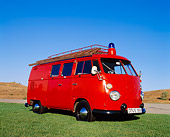 AUT 16 RK0114 01
1966 Volkswagen Firebus Red Low 3/4 Front View On Grass Blue Sky