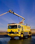 AUT 16 RK0123 12
2002 Oshkosh TI 3000 ARFF Vehicle 3/4 Front View On Pavement Spraying Water