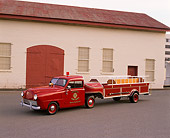 AUT 16 RK0133 02
1949 Crosley Ladder Fire Truck Red 3/4 Front View On Pavement By Building