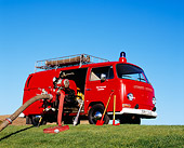 AUT 16 RK0143 08
1969 Volkswagen German Firebus Red 3/4 Side View On Grass Hill