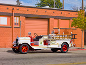 AUT 16 RK0155 01
1929 American LaFrance Triple Combination Fire Truck White 3/4 Front View By Building