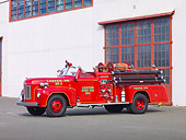 AUT 16 RK0158 01
1954 Ahrens-Fox Fire Truck Red 3/4 Front View By Building