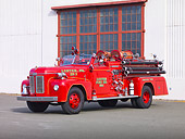 AUT 16 RK0159 01
1954 Ahrens-Fox Fire Truck Red 3/4 Front View By Building