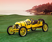 AUT 17 RK0101 02
1919 Ford Model T Speedster Yellow And Black 3/4 Front View On Grass By Water Red Sky Pebble Beach