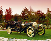 AUT 17 RK0141 01
1909 Locomobile Blue 3/4 Side View On Grass Trees Background