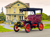 AUT 17 RK0190 01
1907 Cadillac Victoria Touring Model M Burgundy 3/4 Front View On Pavement By House