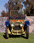 AUT 17 RK0051 03
1910 Oldsmobile LTD Touring Car Head On Shot On Grass By Stone Wall