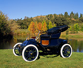 AUT 17 RK0065 01
1906 Autocar Type X Roadster Side 3/4 View On Grass By Water Fall Trees