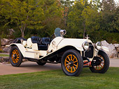 AUT 17 RK0165 01
1914 Mitchell Big Six Speedster White Front 3/4 View On Grass By Trees