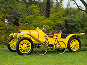 AUT 17 RK0172 01
1913 Pope Hartford Portola Roadster Yellow Front 3/4 View On Grass With 1901 Cleveland Chainless Bicycle Black