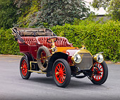 AUT 17 RK0181 01
1906 Locomobile Model H Maroon 3/4 Front View By Shrubs Trees