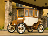 AUT 17 RK0184 01
1909 Rauch & Lang Electric Brougham Brown And Cream 3/4 Front View On Pavement By Building