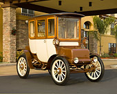 AUT 17 RK0185 01
1909 Rauch & Lang Electric Brougham Brown And Cream 3/4 Front View On Pavement By Building