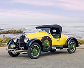 AUT 18 BK0001 01
1924 Kissel 6-55 Speedster Yellow 3/4 Front View On Pavement By Beach