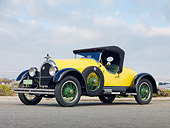 AUT 18 BK0002 01
1924 Kissel 6-55 Speedster Yellow 3/4 Front View On Pavement By Beach