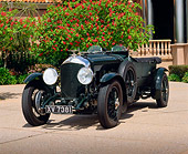 AUT 18 RK0029 04
1928 Bentley Le Mans Racing Car Green 3/4 Front View On Pavement By Tree