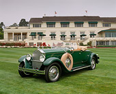 AUT 18 RK0056 02
1929 Packard 645 Roadster Green 3/4 Front View On Grass By Building