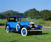 AUT 18 RK0061 02
1923 Rolls Royce Silver Ghost Blue 3/4 Front View On Grass Trees Blue Sky
