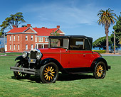 AUT 18 RK0064 02
1928 Chevrolet Cabriolet Convertible Red 3/4 Front View On Grass By Trees Blue Sky