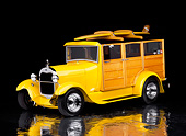 AUT 18 RK0065 20
1929 Ford Woody Street Rod Yellow With Surfboard 3/4 Front View On Mylar Floor Studio