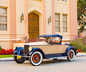 AUT 18 RK0773 01
1925 Pierce-Arrow Model 80 Blue And Brown 3/4 Front View On Pavement By Building