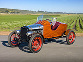 AUT 18 RK0785 01
1926 Ford Model T Speedster Natural Wood 3/4 Front View On Pavement By Farm