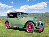 AUT 18 RK0808 01
1920 Overland Roadster Green 3/4 Front View On Grass By Mountains And Trees
